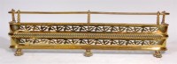 Lot 475 - A Regency brass fire fender, of D-shape and...