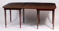 Lot 479 - A late Georgian mahogany double D-end dining...