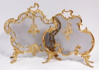 Lot 493 - A French Rococo Revival gilt brass fire screen,...