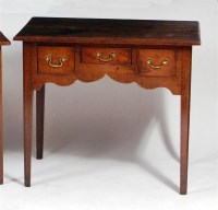 Lot 495 - A George III oak lowboy, having three frieze...