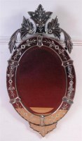 Lot 502 - A Venetian glass oval wall mirror, with...