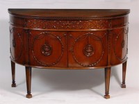 Lot 506 - An Adam style mahogany sideboard, the frieze...