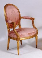 Lot 513 - A French Louis XV style giltwood fauteuil, of...