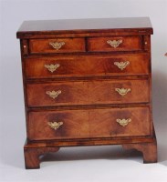 Lot 516 - A walnut bachelors chest, having a crossbanded...