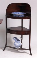 Lot 530 - A late Georgian mahogany three tier bowfront...