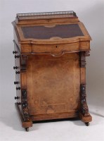 Lot 562 - A Victorian figured walnut kneehole writing...