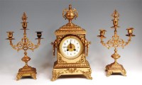 Lot 427 - A late 19th century gilt brass three piece...