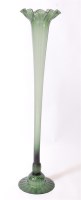 Lot 1160 - A circa 1900 green glass floor vase, of...