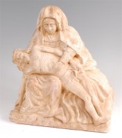 Lot 1388 - A 19th century carved limestone pieta, in...