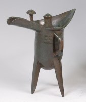 Lot 1436 - A Chinese bronze tripod ritual wine cup,...