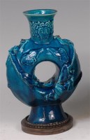 Lot 1447 - A Chinese turquoise glazed moonflask, the...