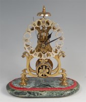 Lot 1546 - A Victorian style brass skeleton clock, having...