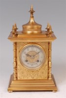 Lot 1568 - A late 19th century gilt brass cased mantel...