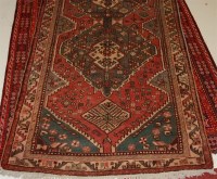 Lot 1577 - A Persian woollen Qashqai rug, the complex...
