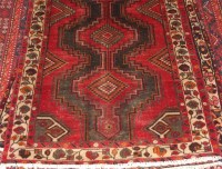 Lot 1578 - A Kurdish woollen rug, the wide poled field...