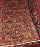 Lot 1579 - A Persian woollen runner, having ornate...
