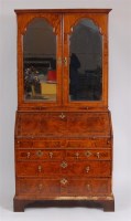 Lot 1587 - An early 18th century walnut bureau cabinet,...