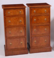 Lot 1609 - A pair of figured walnut four drawer chests,...