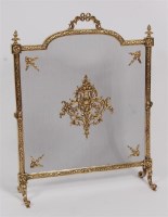 Lot 1622 - A Victorian brass fire screen, the wirework...