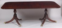 Lot 1631 - A mahogany twin pillar dining table, early...