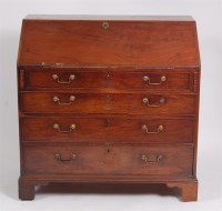 Lot 1637 - A George III mahogany writing bureau, having a...