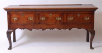 Lot 1645 - An antique oak dresser base, having three...
