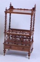 Lot 1647 - A Victorian figured walnut canterbury whatnot,...