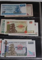 Lot 140 - A folder of 177 world banknotes to include;...