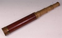 Lot 234 - A 19th century brass and mahogany clad four...
