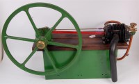 Lot 35 - An unusual single cylinder gas engine having...