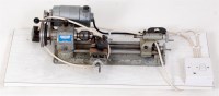 Lot 112 - 2 electrically operated table top model makers...