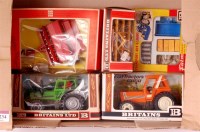 Lot 1234 - Britains, boxed tractor and implement group to...