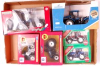 Lot 1211 - New Holland 1/32nd scale boxed tractor group...