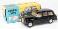 Lot 1639 - Corgi Toys, 418 Austin FX4 taxi, black body...
