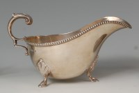 Lot 412 - A Mappin & Webb silver sauceboat, in the...