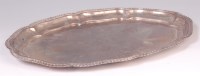 Lot 426 - A silver salver, of shaped oval form, having a...