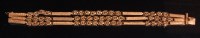 Lot 483 - A modern 18ct gold three string bracelet, of...