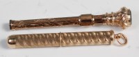 Lot 567 - A 9ct gold propelling toothpick, with engine...