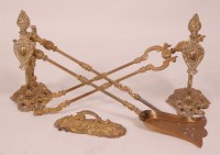 Lot 579 - A Victorian cast brass fireside suite,...