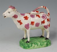 Lot 757 - A 19th century Staffordshire cow creamer,...