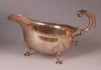 Lot 826 - *A Mappin & Webb silver sauceboat, having...