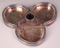 Lot 828 - *An Irish silver desk-stand, modelled as three...