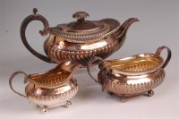 Lot 884 - A late Georgian silver three piece teaset,...