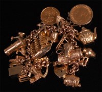 Lot 895 - A 9ct gold curblink charm bracelet, with...