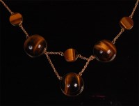 Lot 901 - A yellow metal and tigers eye set finelink...