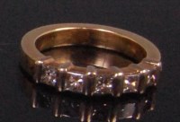 Lot 967 - A modern yellow gold diamond set half eternity...