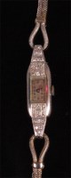 Lot 1007 - An Art Deco ladies platinum and diamond set...