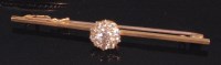 Lot 506 - A yellow metal diamond set bar brooch,...