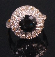 Lot 522 - An 18ct gold sapphire and diamond cluster ring,...