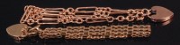 Lot 534 - A 9ct gold gatelink bracelet, with heart...